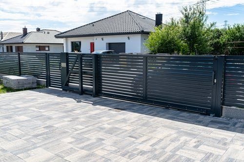 Modern black powder-coated aluminum fence installed at a Virginia Beach home by Fast Fences LLC