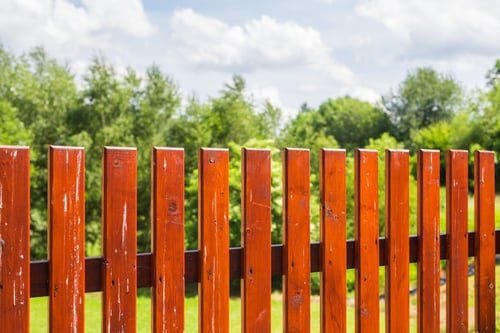 Cedar wood picket fence with warm natural finish installed by Fast Fences LLC in Virginia